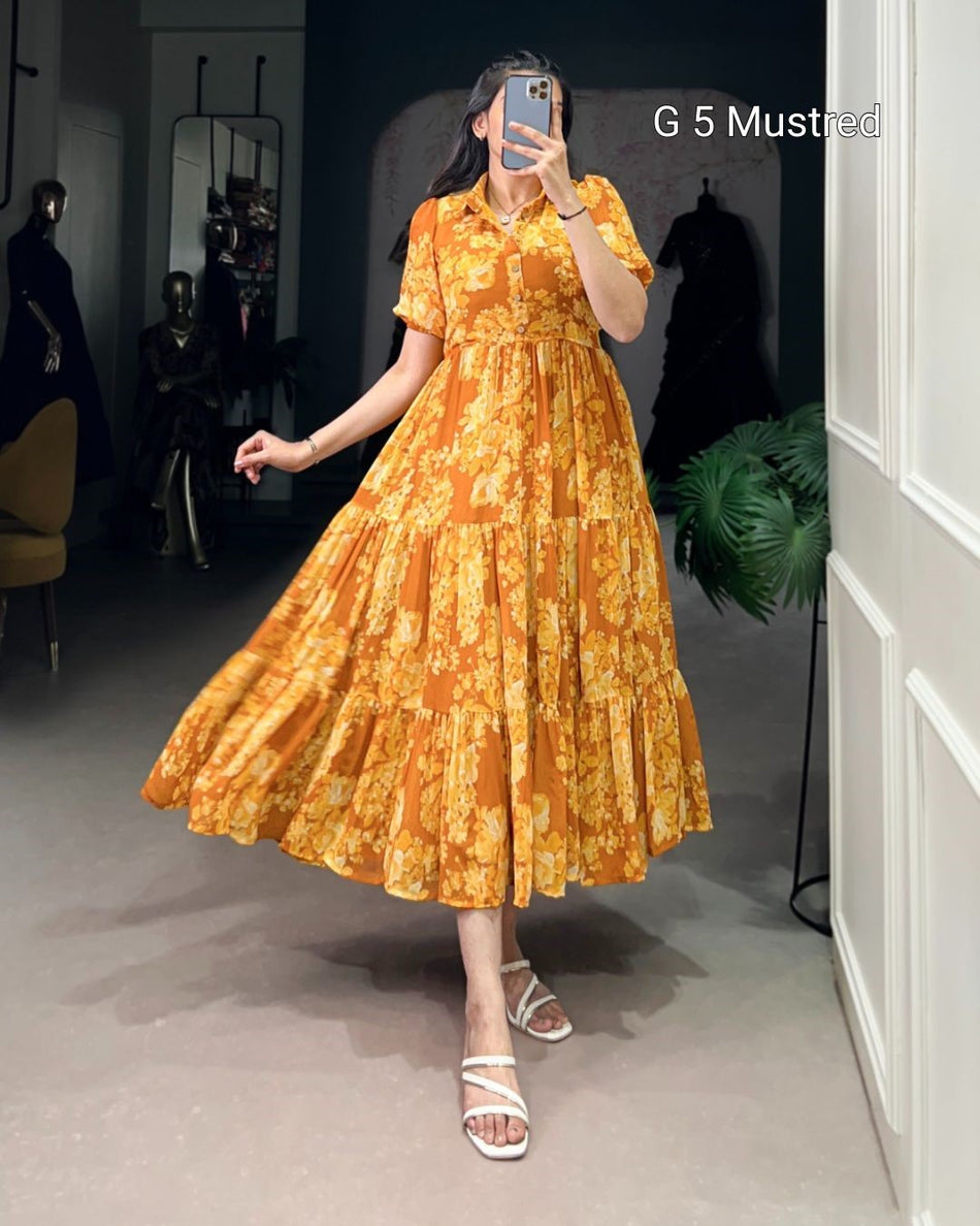 Person wearing a yellow floral dress taking a mirror selfie in a room.