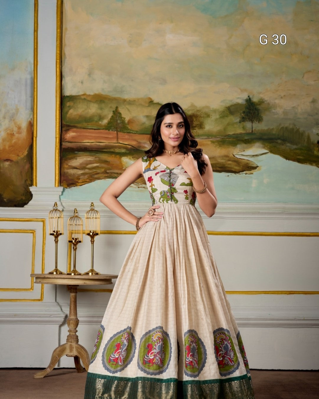 Woman in a floral dress standing in an elegant room with a painting on the wall.