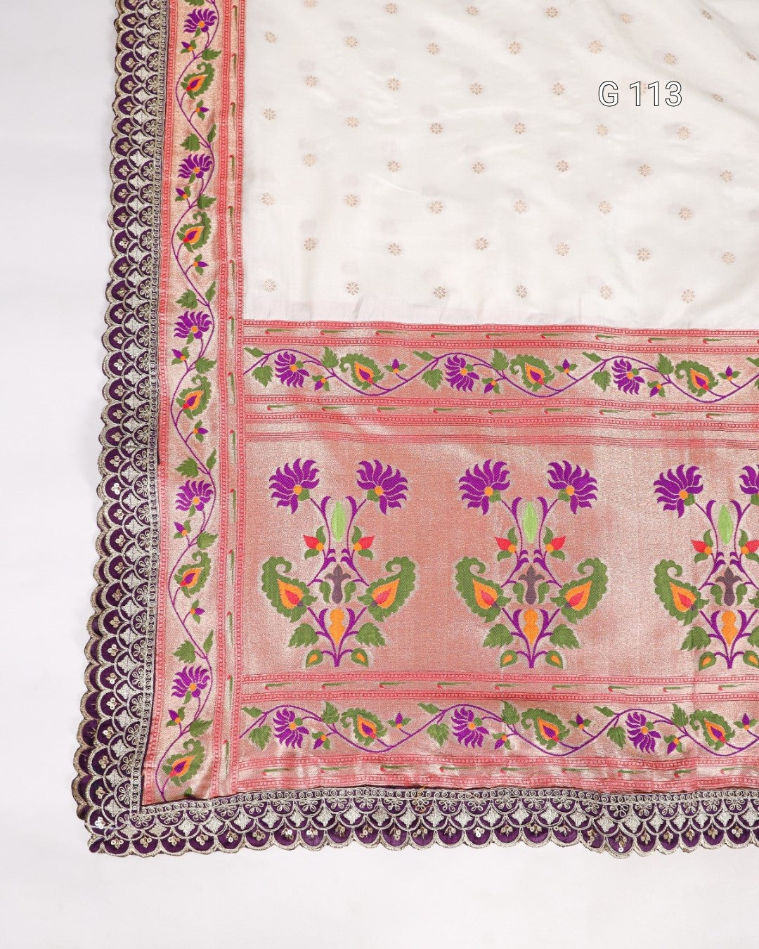 Decorative fabric with floral patterns and a border on a white background