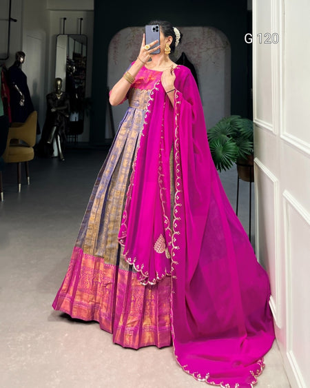Person wearing a pink saree with a gold border in a room setting.