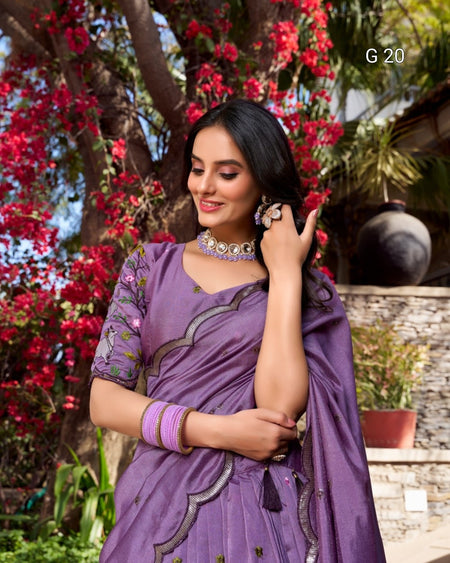 Woman in a purple saree with floral background