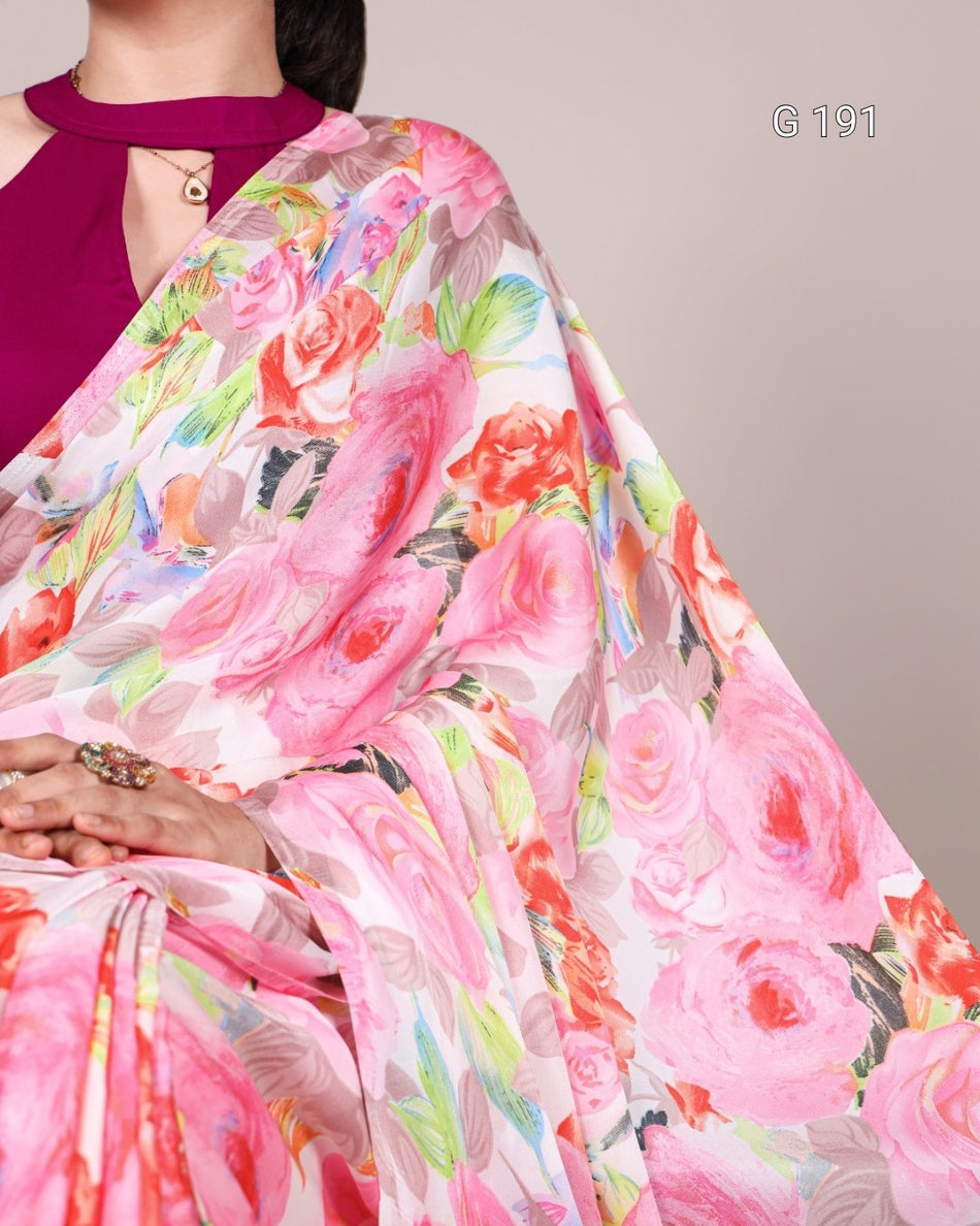 Floral saree with pink and multicolor design on a plain background