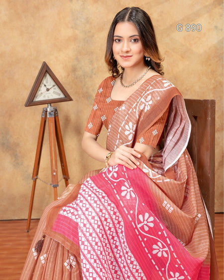 Woman wearing a traditional saree with a decorative background