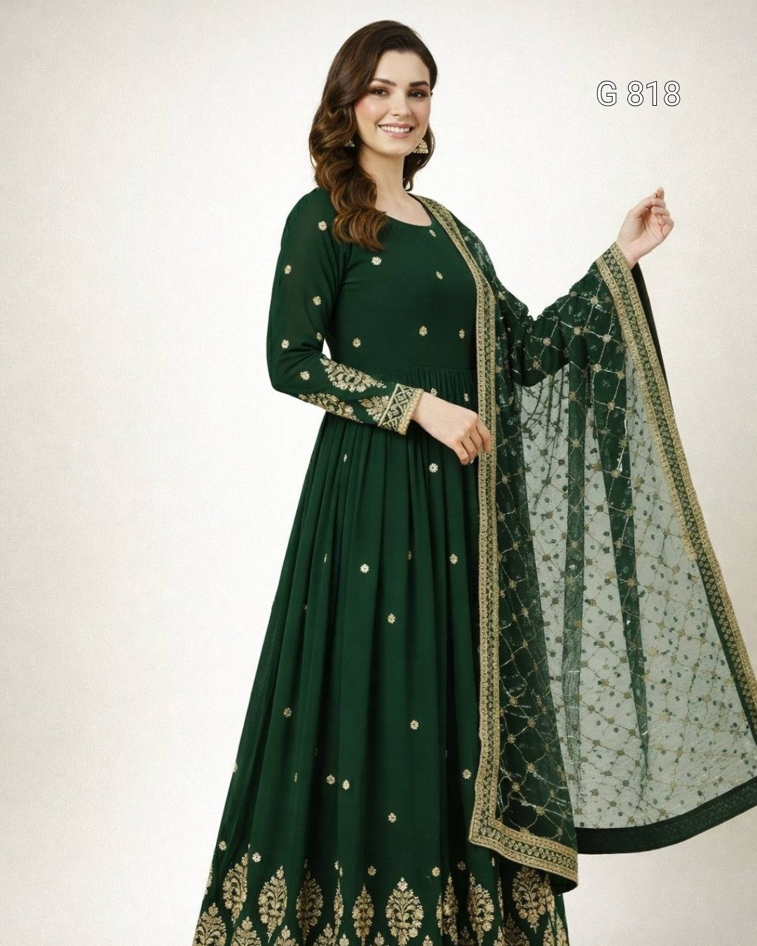 Green embroidered traditional outfit with a matching dupatta on a white background