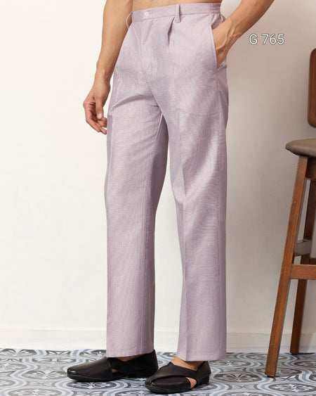 Person wearing light purple pants with a neutral background