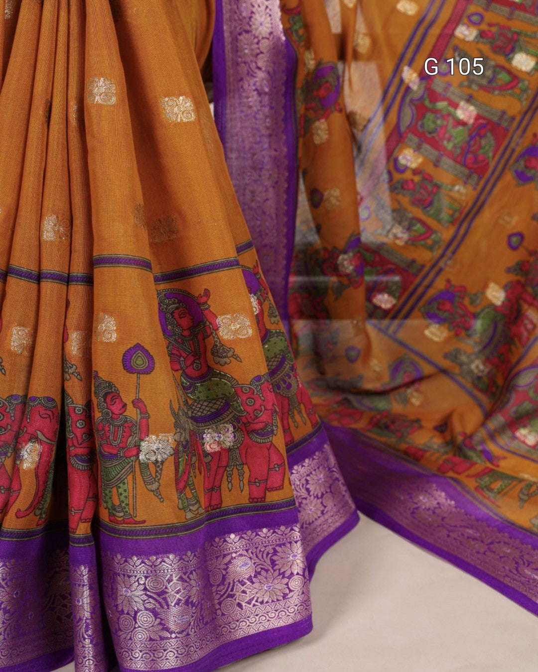 Colorful saree with intricate patterns on a white background