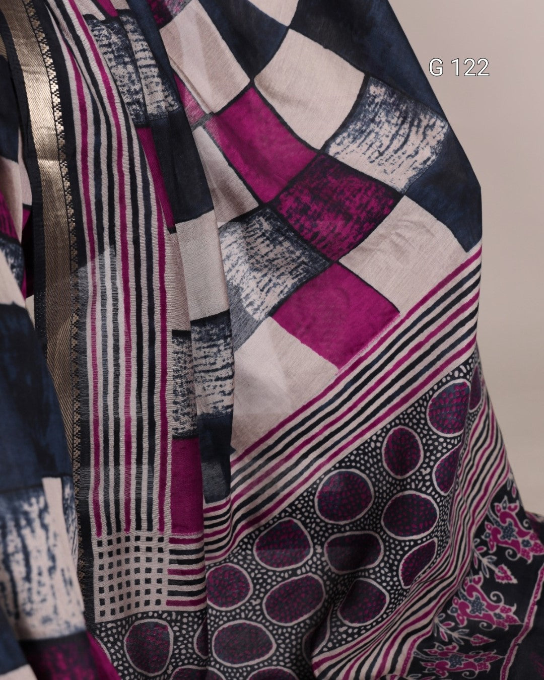 Close-up of a patterned fabric with geometric and abstract designs.