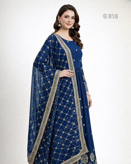 Woman wearing a blue traditional outfit with gold embroidery on a white background