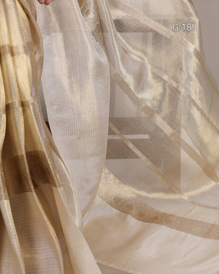 Close-up of sheer fabric with a subtle pattern, showing texture and color variations.