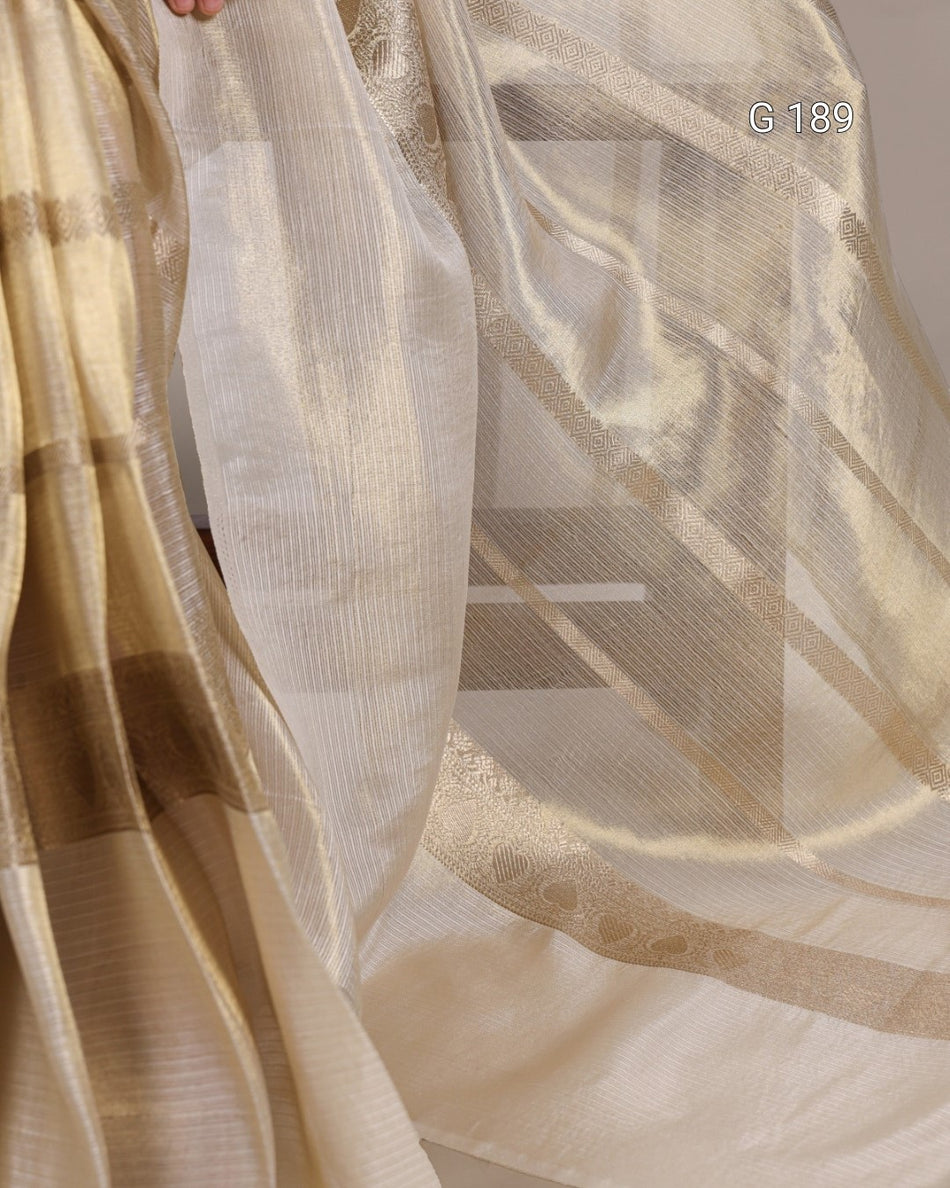Close-up of sheer fabric with a subtle pattern, showing texture and color variations.