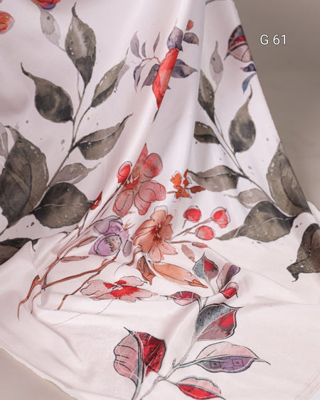 Floral patterned fabric with red, purple, and green leaves on a white background