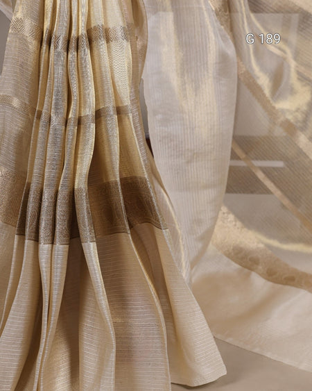 Close-up of beige and brown checkered fabric with a blurred background