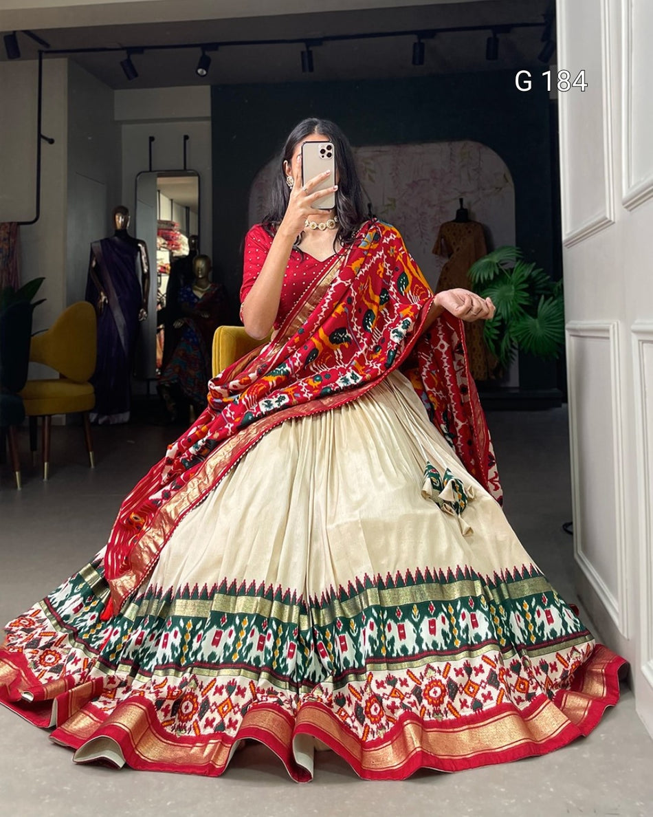 Woman wearing a colorful saree in an indoor setting