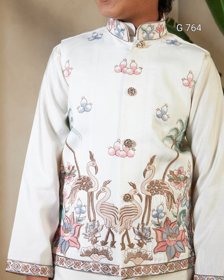 Embroidered traditional garment with floral and bird patterns on a plain background