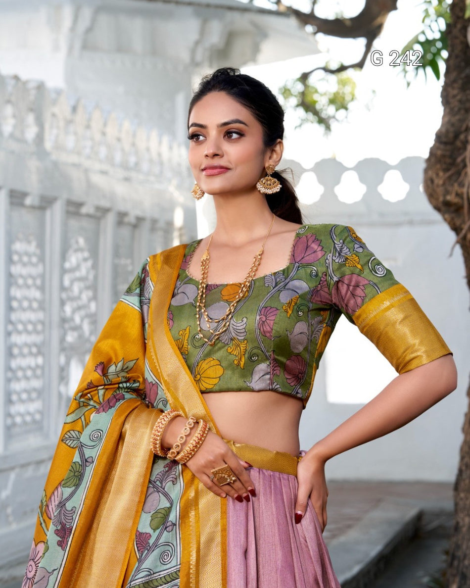 Woman wearing a traditional outfit with a floral blouse and yellow dupatta in an outdoor setting.