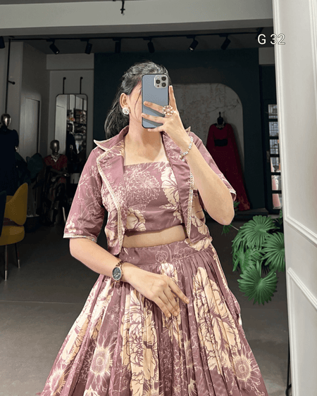 Person wearing a patterned outfit taking a mirror selfie in a store.