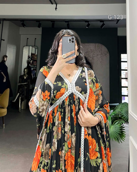 Person wearing a floral dress with a measuring tape around their waist in a room.