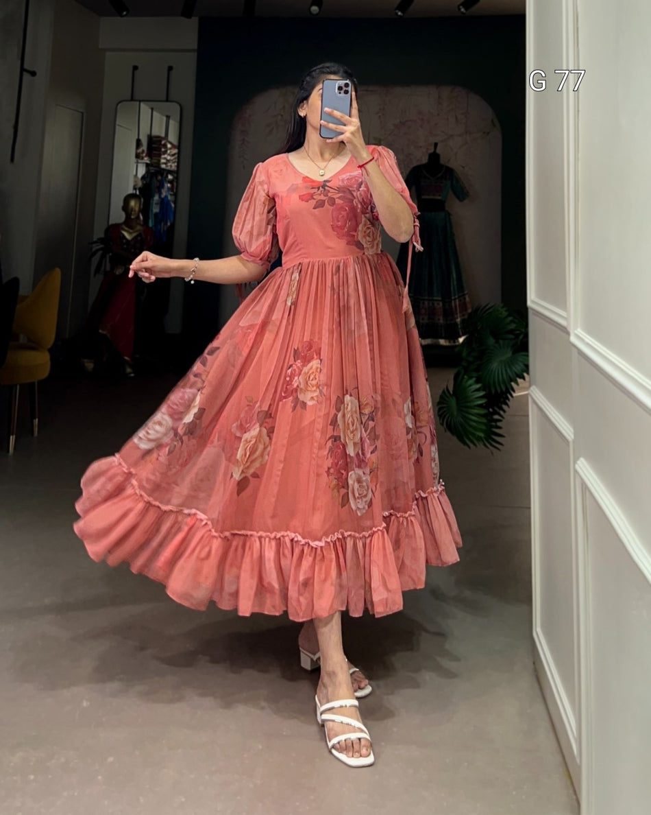 Person wearing a pink floral dress in an indoor setting