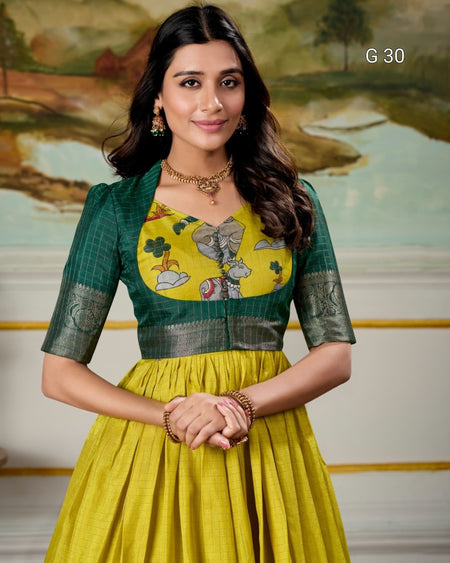 Woman wearing a yellow and green traditional outfit with a scenic background