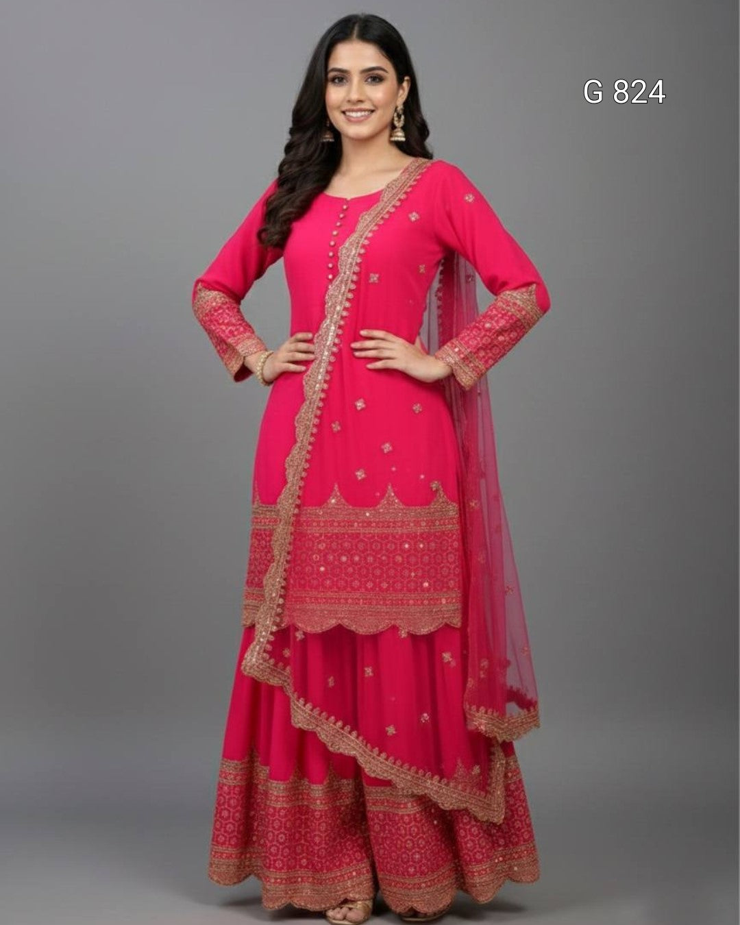 Woman wearing a pink traditional outfit with gold embroidery on a gray background