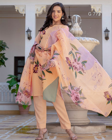 Woman holding a floral scarf in an indoor setting