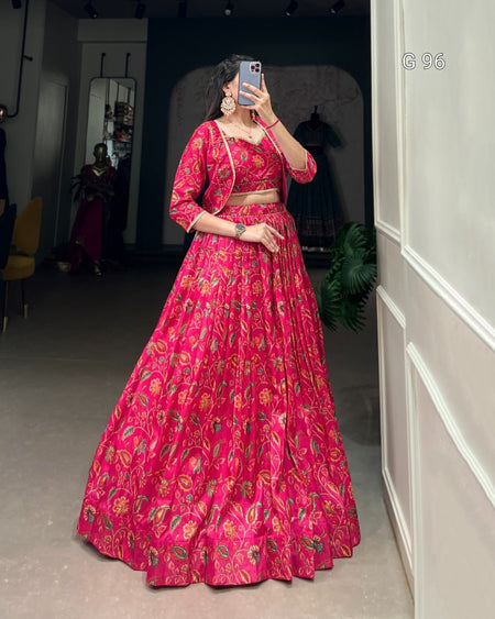 Person wearing a red floral outfit taking a mirror selfie.