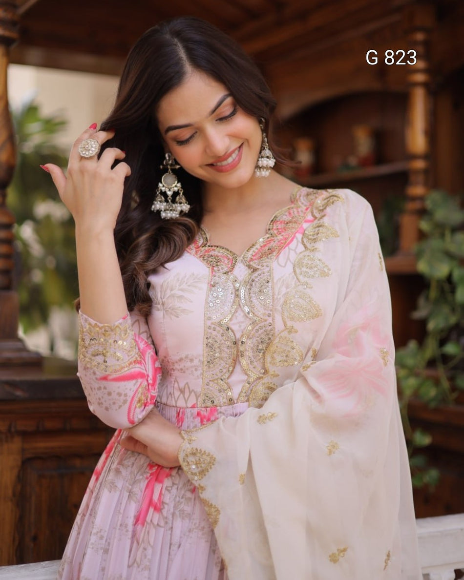 Woman in a traditional outfit with floral patterns in an indoor setting