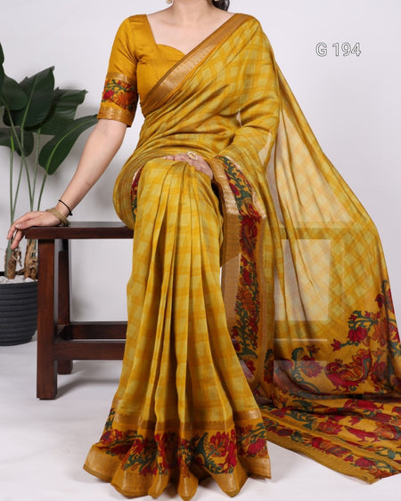 Yellow saree with floral patterns on a white background