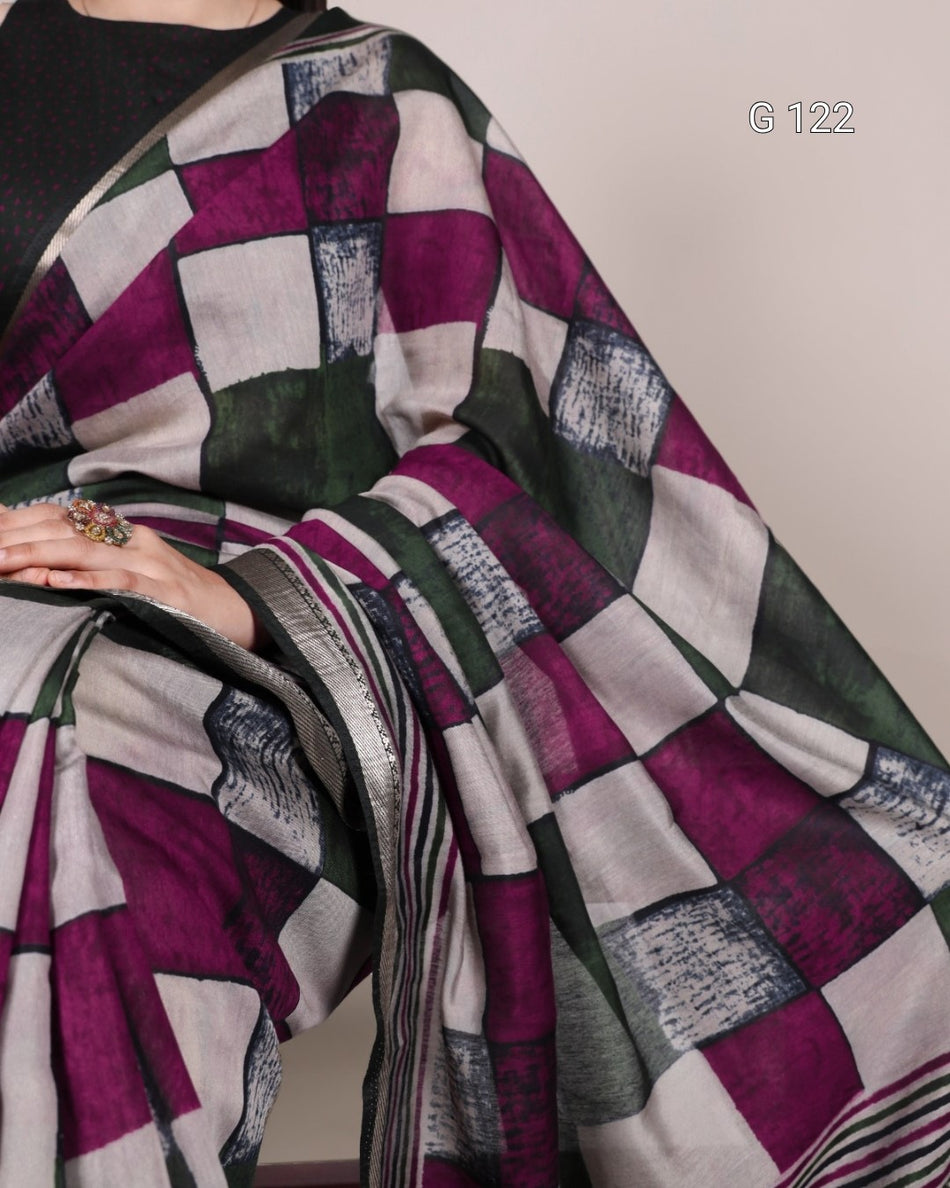 Saree with a geometric pattern draped over a person, on a plain background