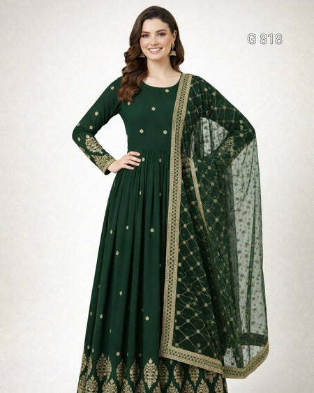 Green traditional outfit with gold patterns on a white background
