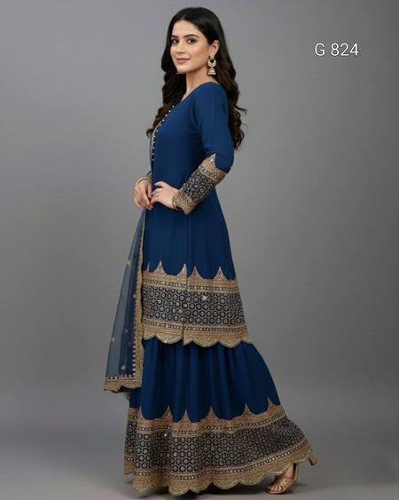 Woman wearing a blue and gold traditional outfit on a gray background