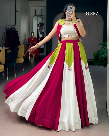 Woman wearing a colorful traditional outfit with a long skirt in a room.