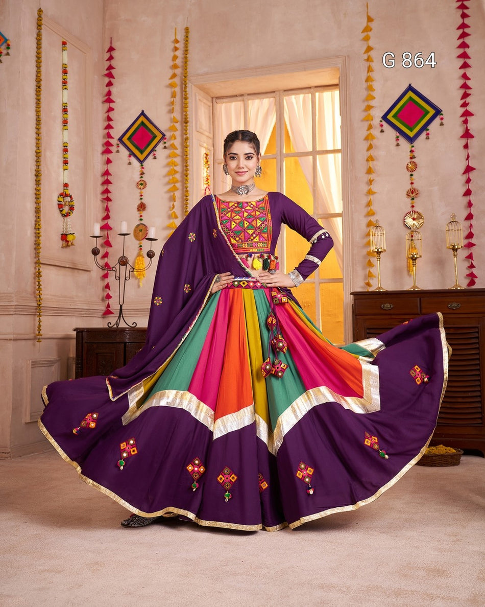 Woman in a colorful traditional outfit with a decorative background