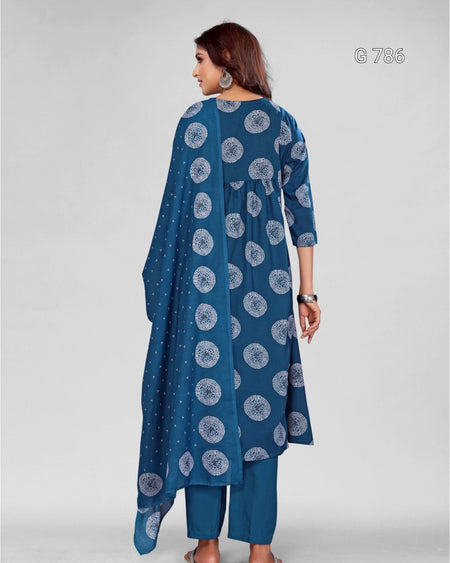 Woman wearing a blue patterned outfit on a gray background