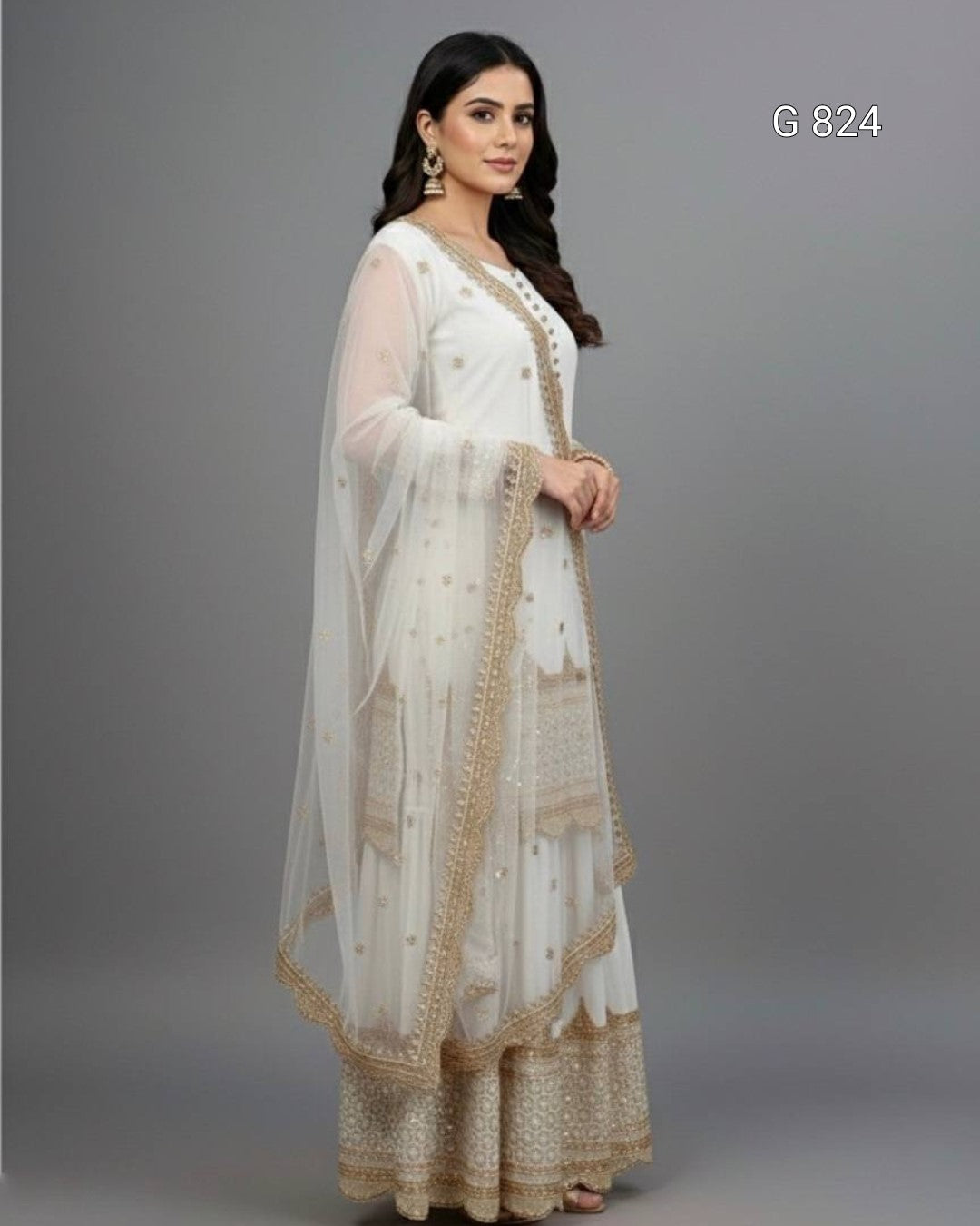 Woman wearing a white and gold traditional outfit on a gray background