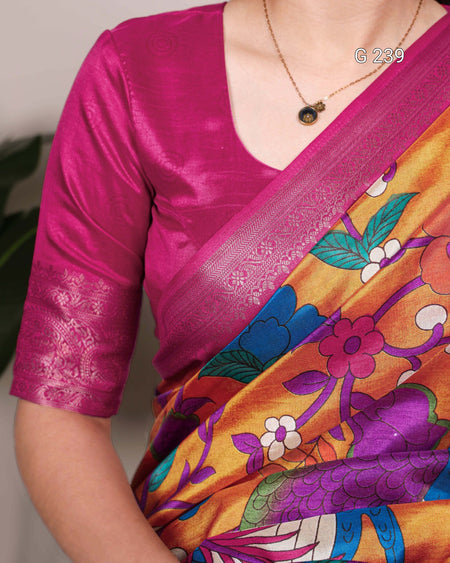 Person wearing a vibrant saree with a colorful floral pattern and a pink blouse.