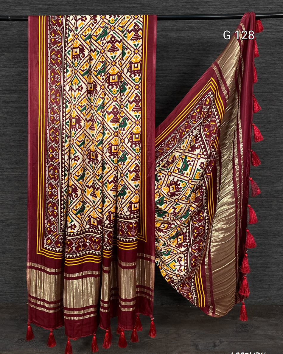 Traditional patterned fabric with tassels on a dark background