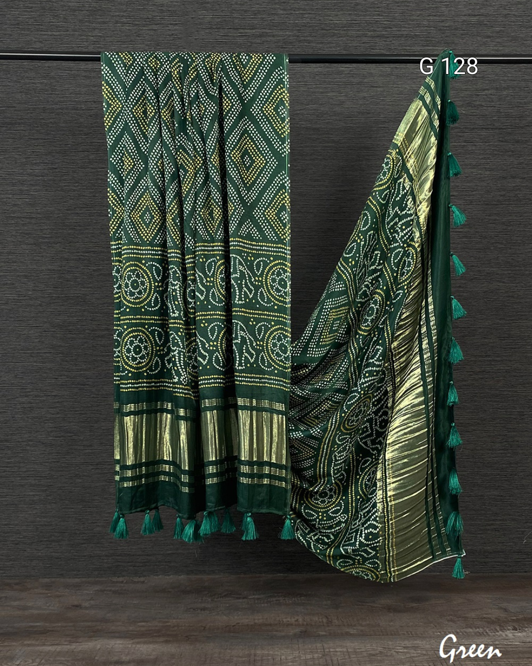 Green patterned scarf with tassels on a dark background
