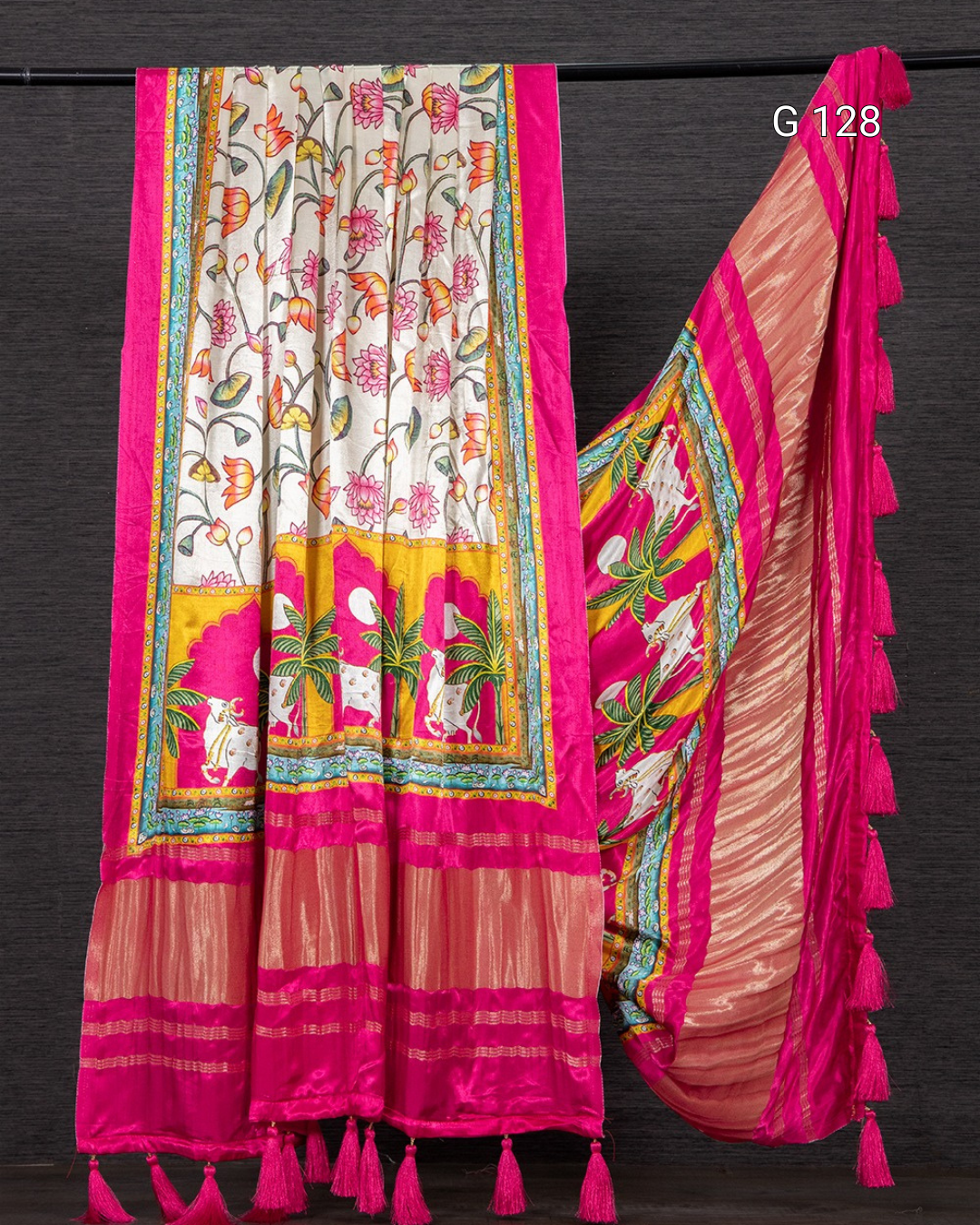 Colorful saree with intricate patterns on a dark background