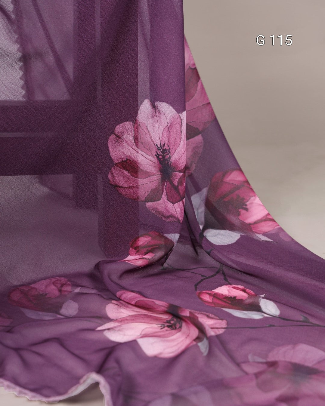 Floral patterned fabric with pink flowers on a purple background