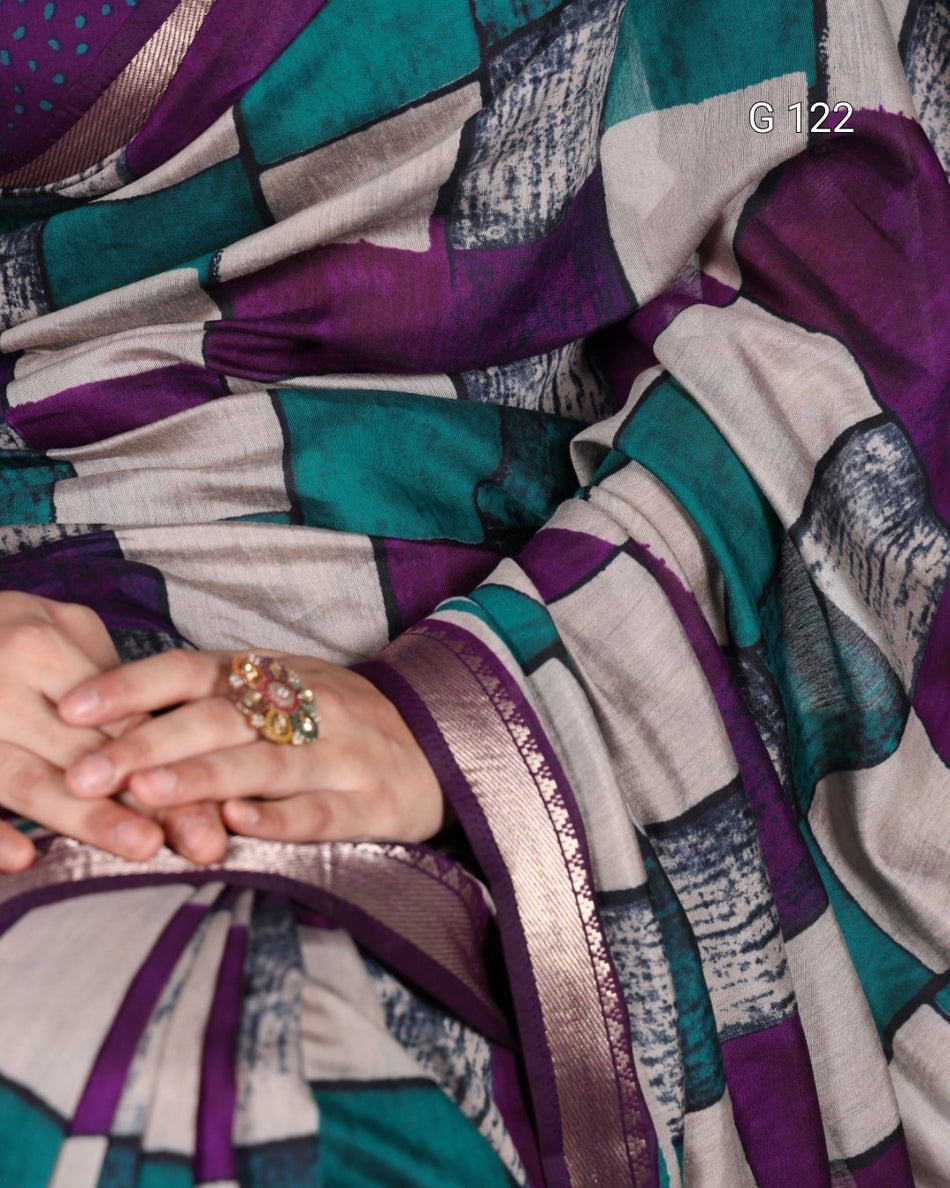 Colorful patterned fabric with a close-up of hands wearing a ring.