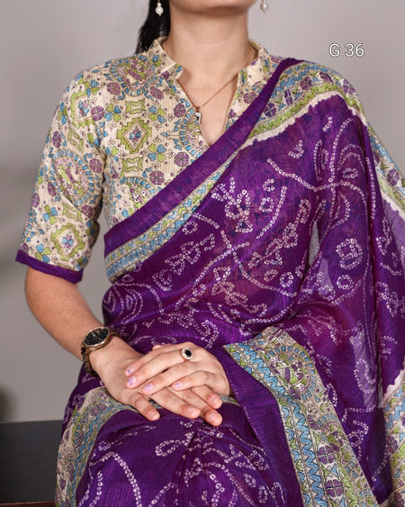 Woman wearing a purple saree with a patterned blouse against a neutral background