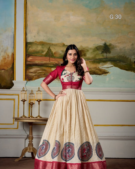 Woman in a traditional outfit standing in an elegant room with a painting in the background