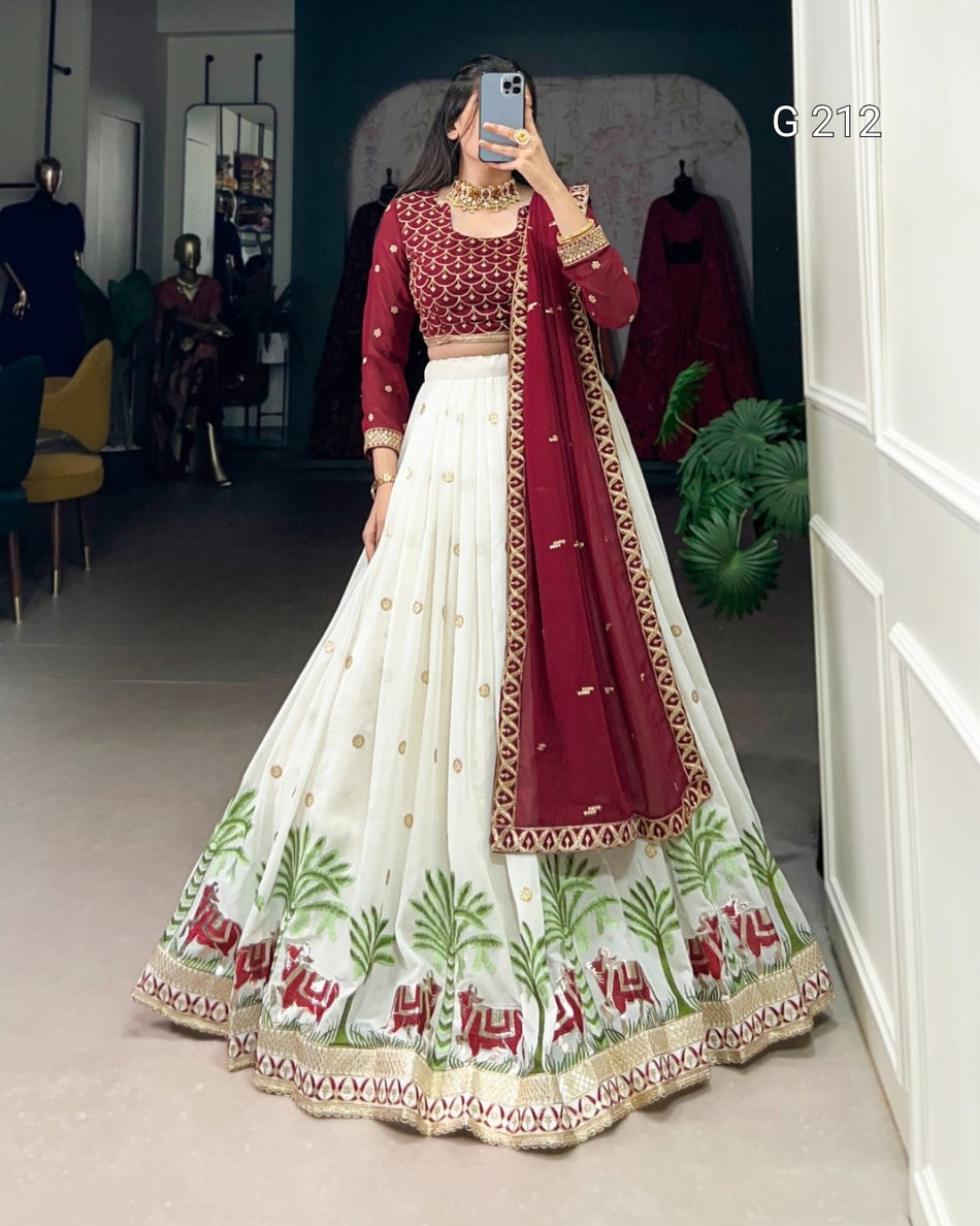 Woman wearing a red and white embroidered traditional outfit in a room.