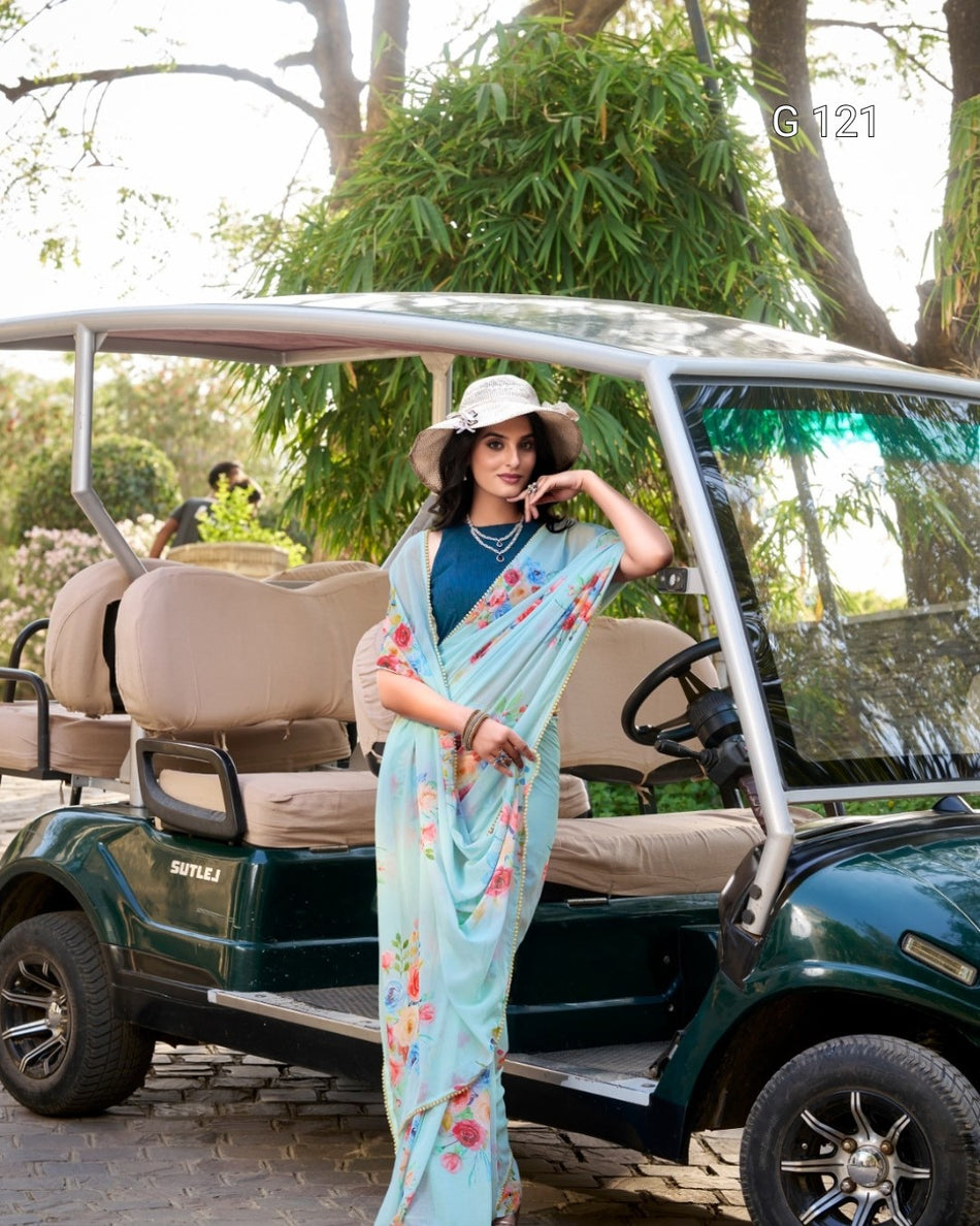 Woman in a floral saree standing next to a golf cart in a park-like setting