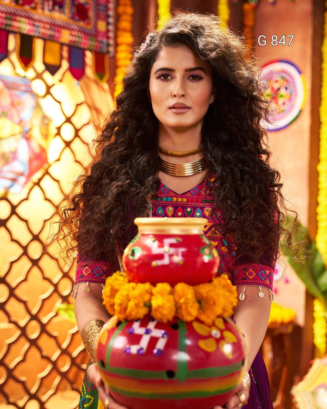 Woman holding a colorful traditional pot with a festive background