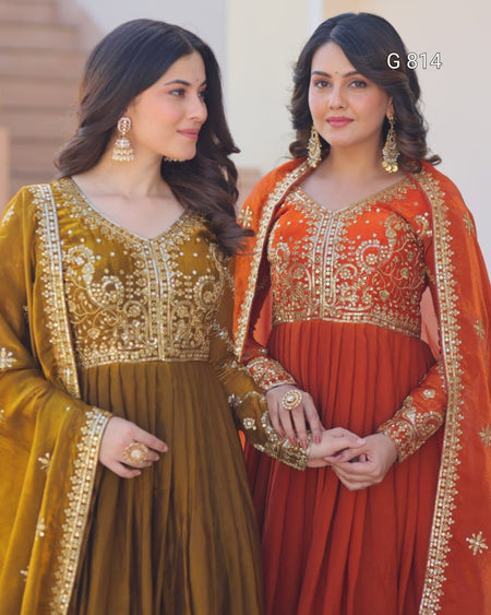 Two women in traditional embroidered dresses standing side by side.