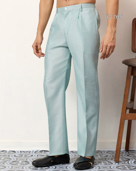 Light blue pants worn by a person on a white background