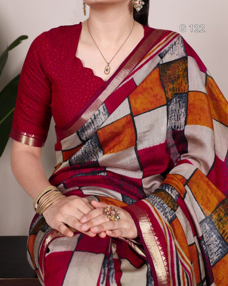 Woman wearing a colorful saree with a patterned blouse against a neutral background
