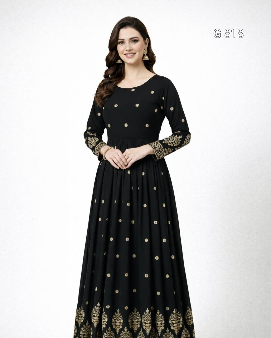 Black dress with gold embroidery on a white background